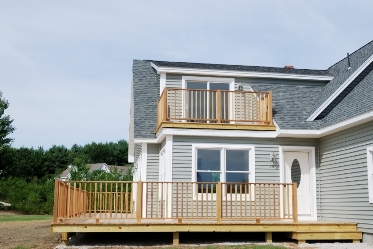 photo of a deck and porch being built on a house