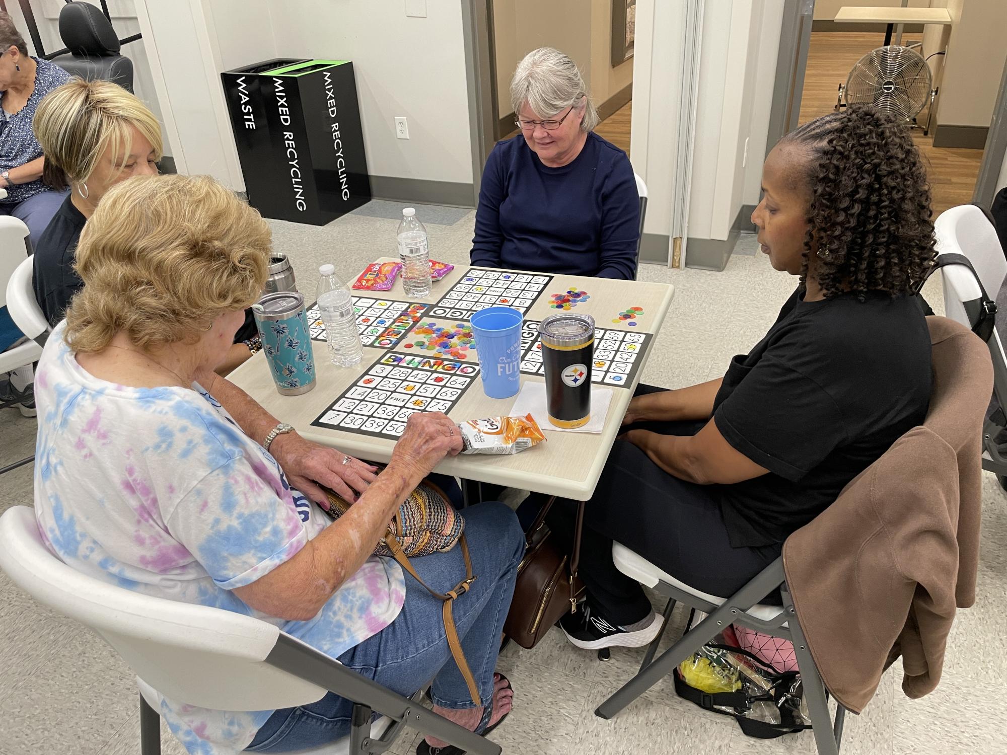 Four ladies sitting at a table playing Bingo
