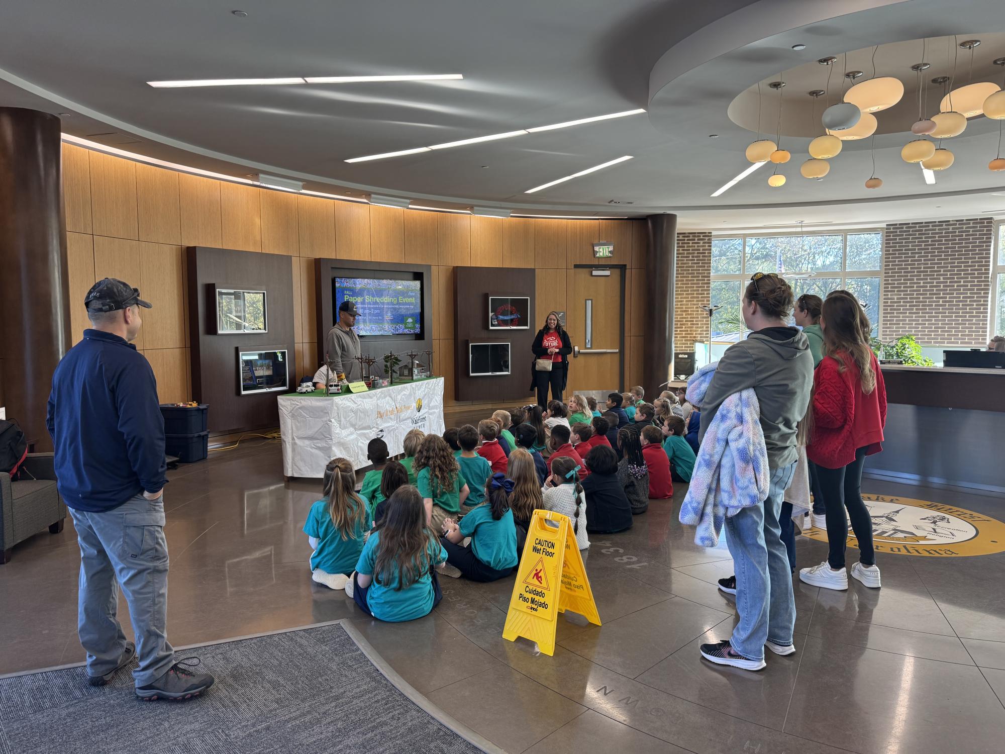 School children participating in a demonstration given by a Wake Forest Power Lineman